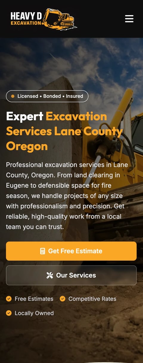 Heavy D Excavation website homepage showing yellow excavator on construction site for Lane County Oregon excavation services